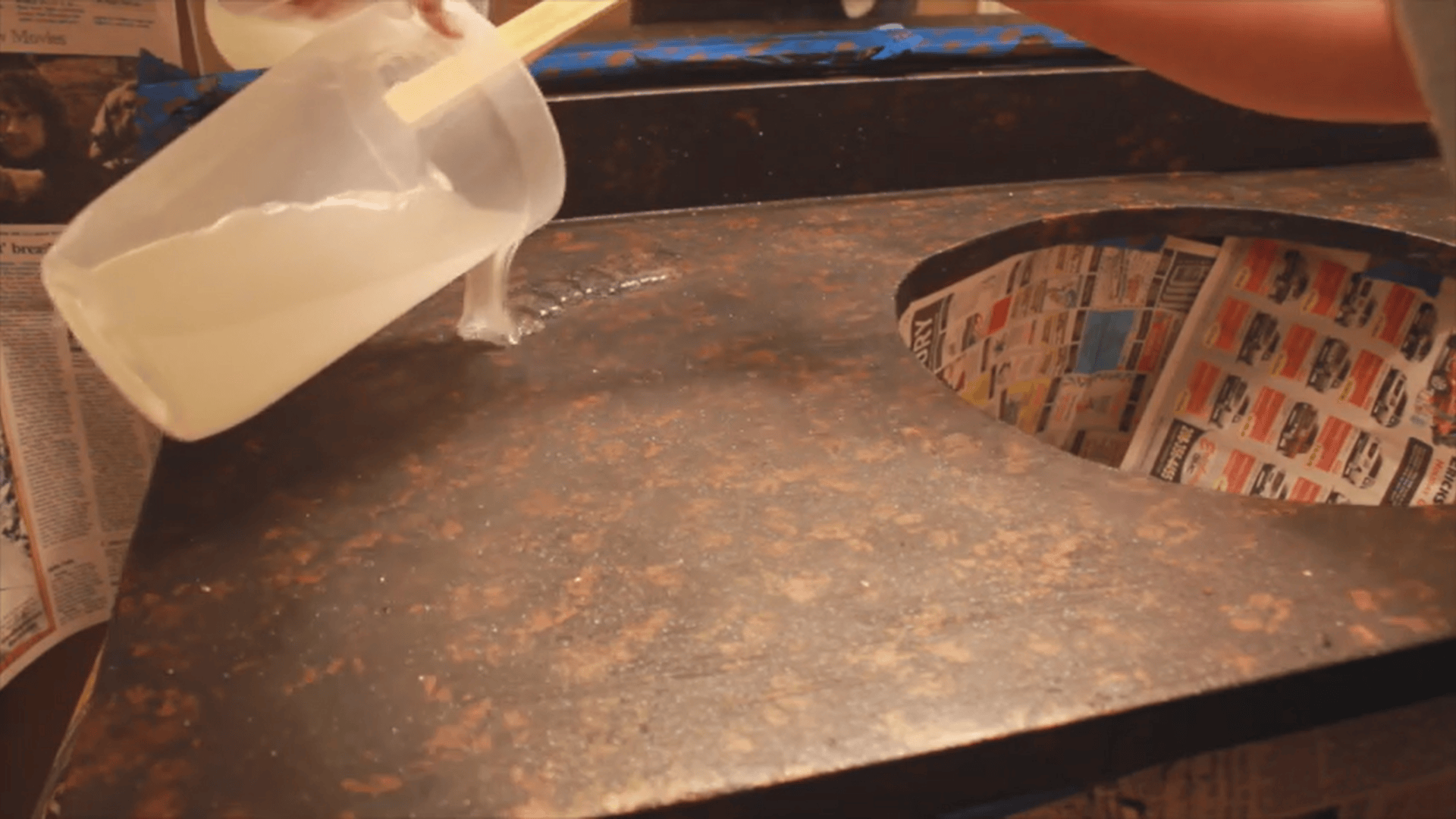 Pouring liquid coating onto textured surface during resurfacing laminate countertops process