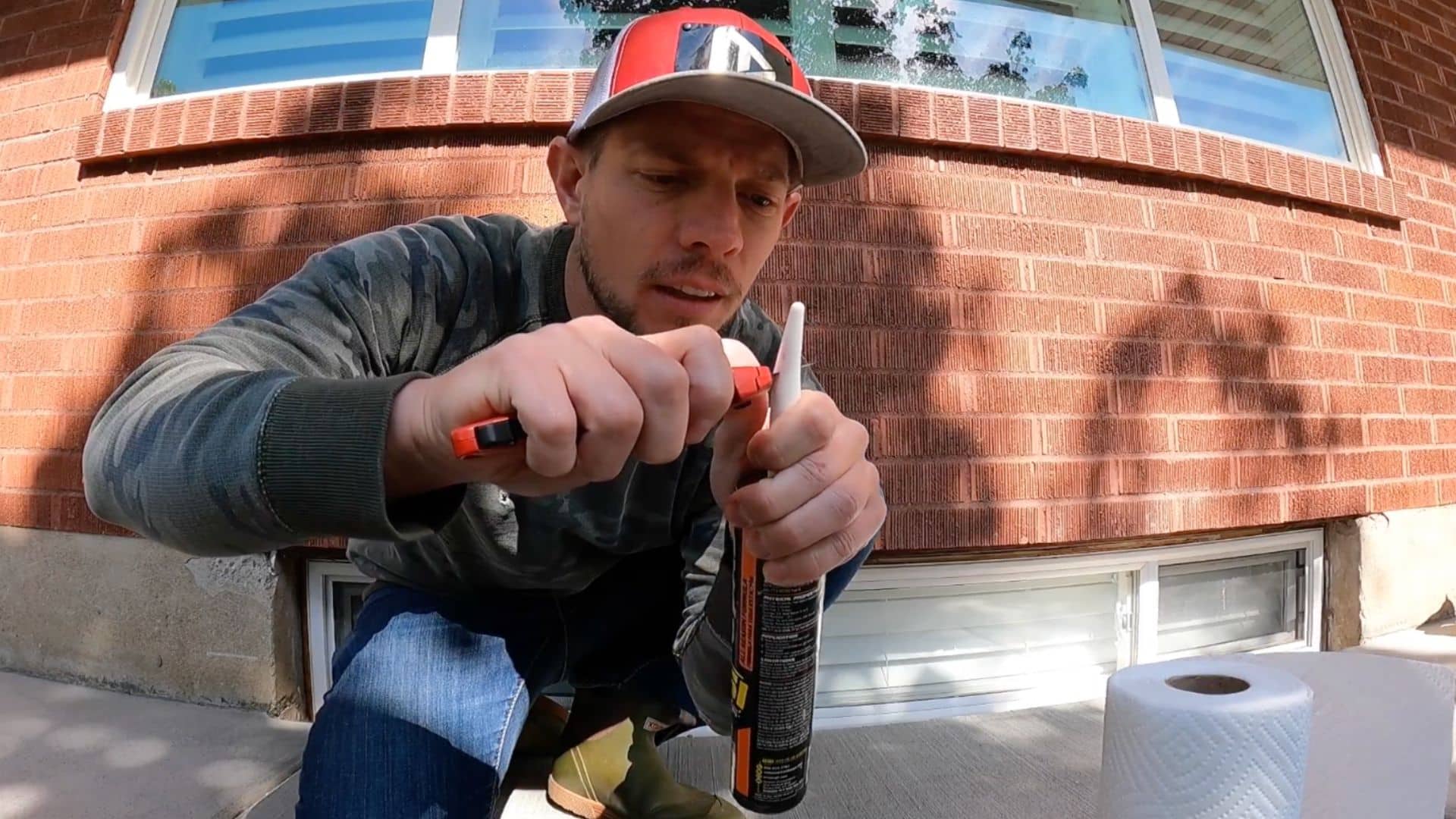 preparing caulking gun and cutting nozzle tip for smooth and controlled caulk application
