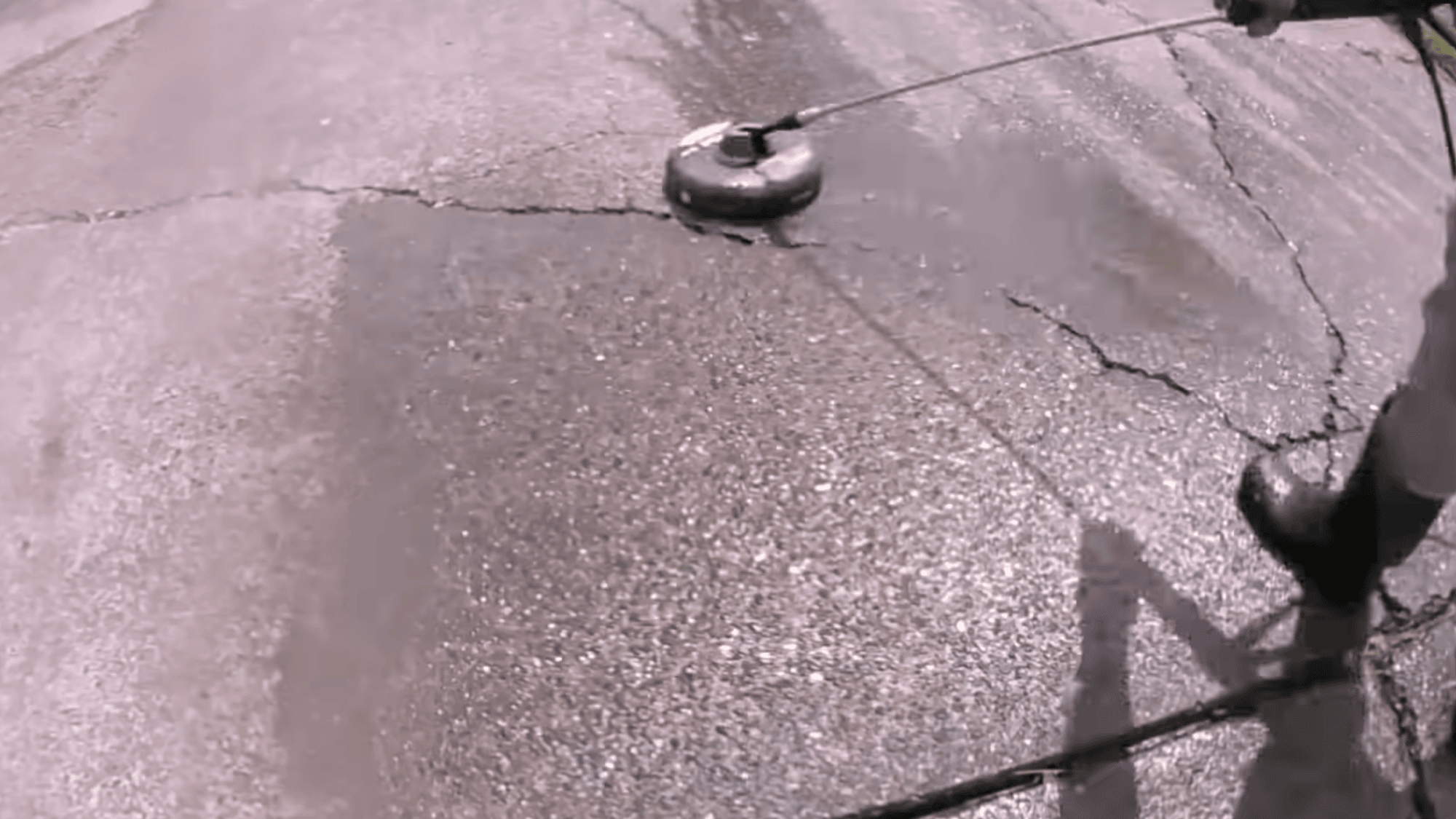 pressure washing main surface of driveway during concrete driveway resurfacing preparation