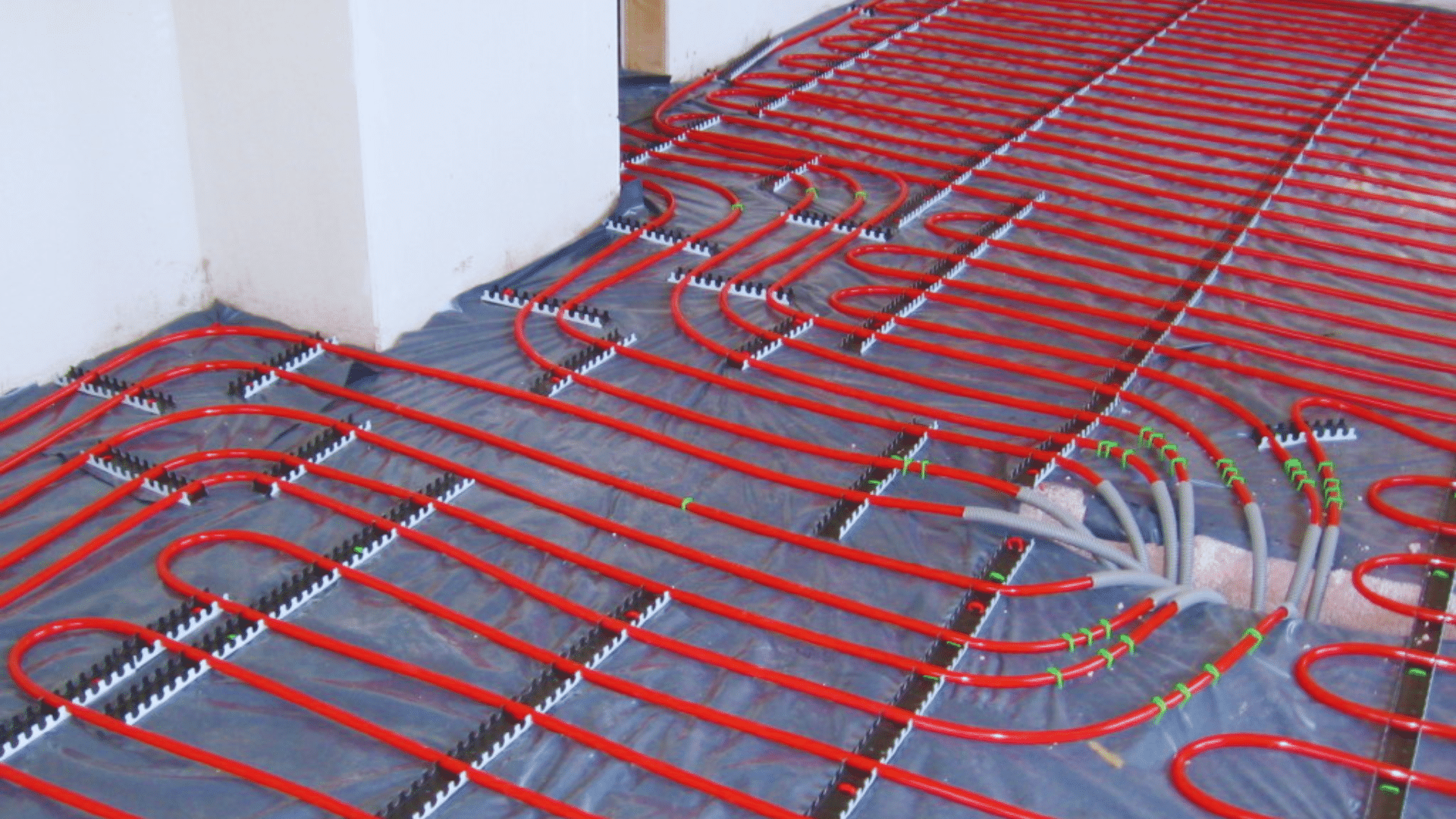 radiant floor heating pipes arranged on the floor ready for installation