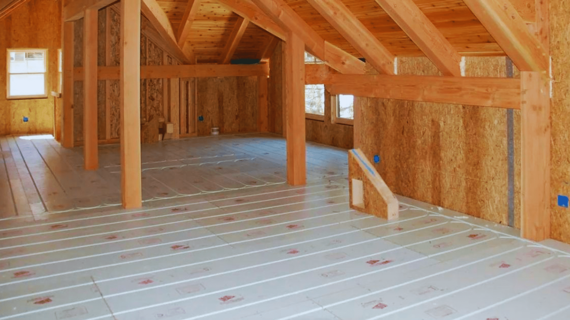 radiant floor heating system installed in an attic with panels laid out