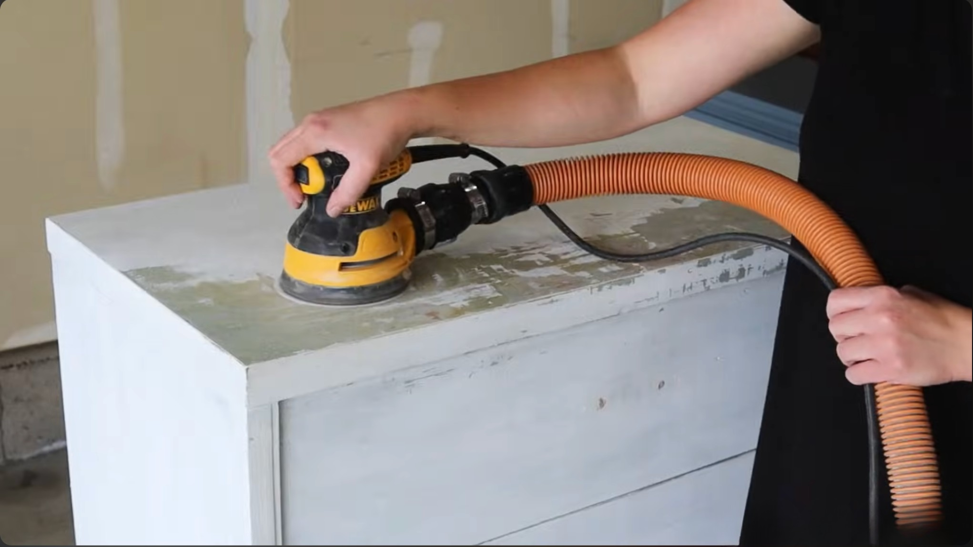 sanding wood surface evenly to remove remaining paint and prepare it for smooth finishing (2)