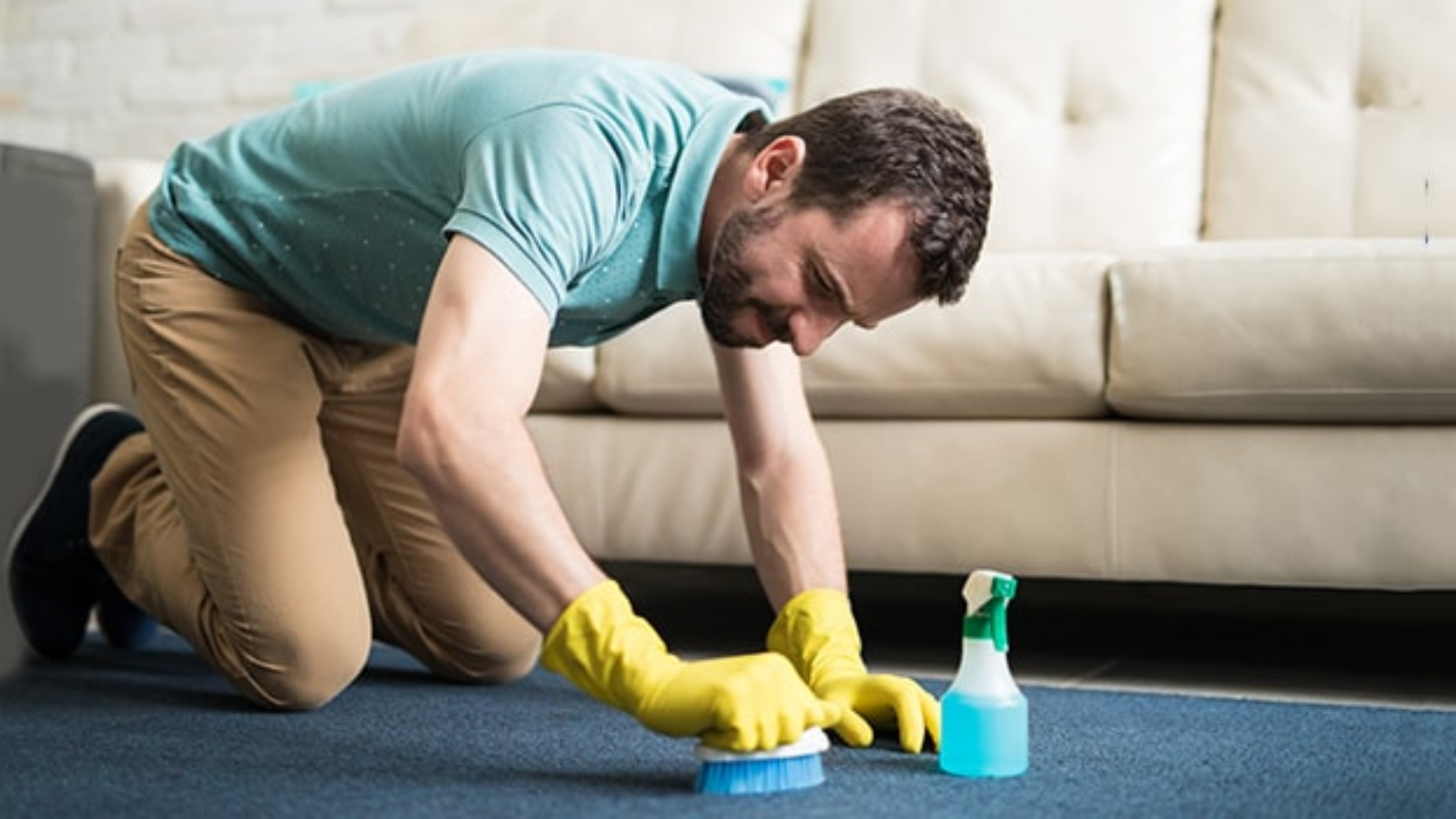 scrubbing carpet stain during seasonal house cleaning routine