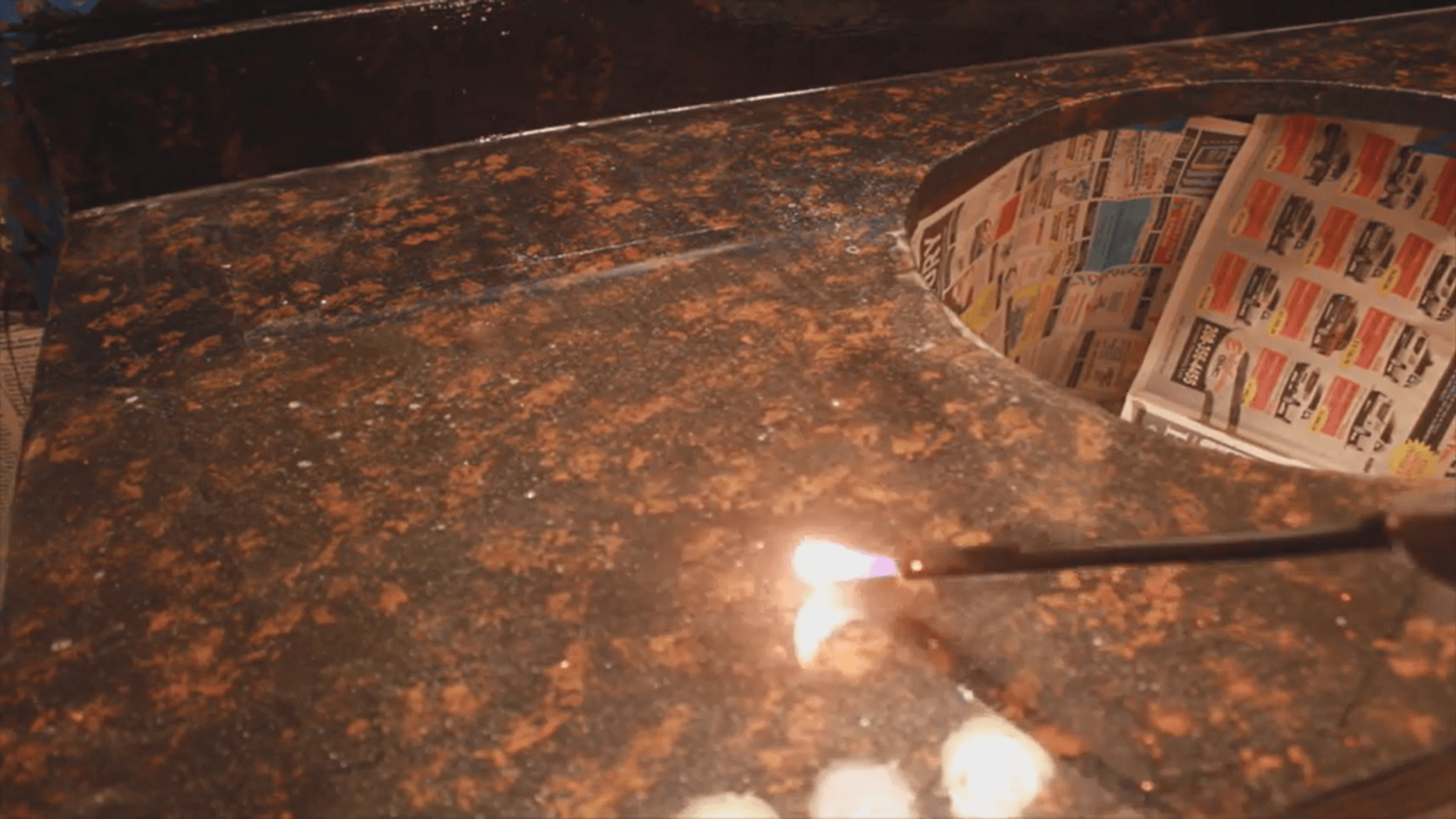 Using small torch flame on coated surface during resurfacing laminate countertops process