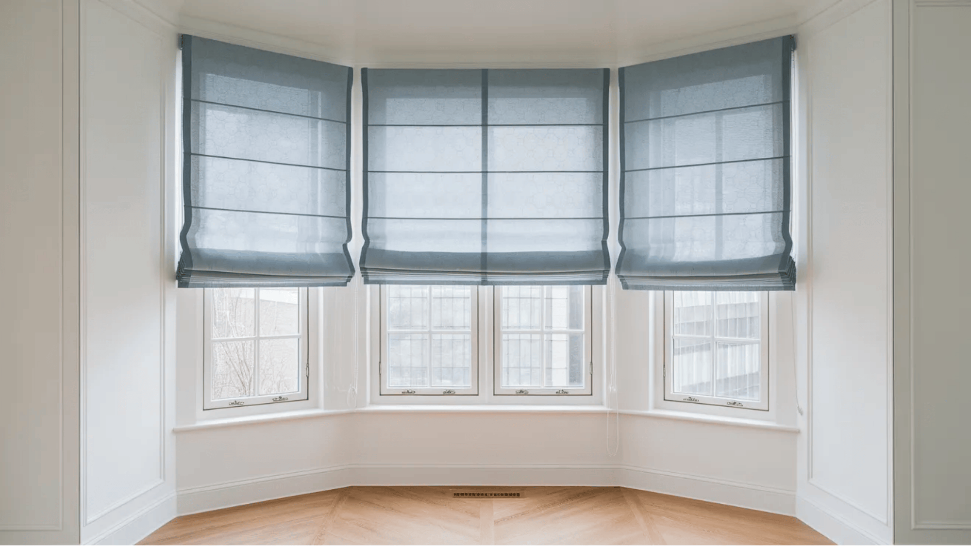 what is a roman shade blue roman shades neatly folded above bay windows in bright empty room with light wood floor