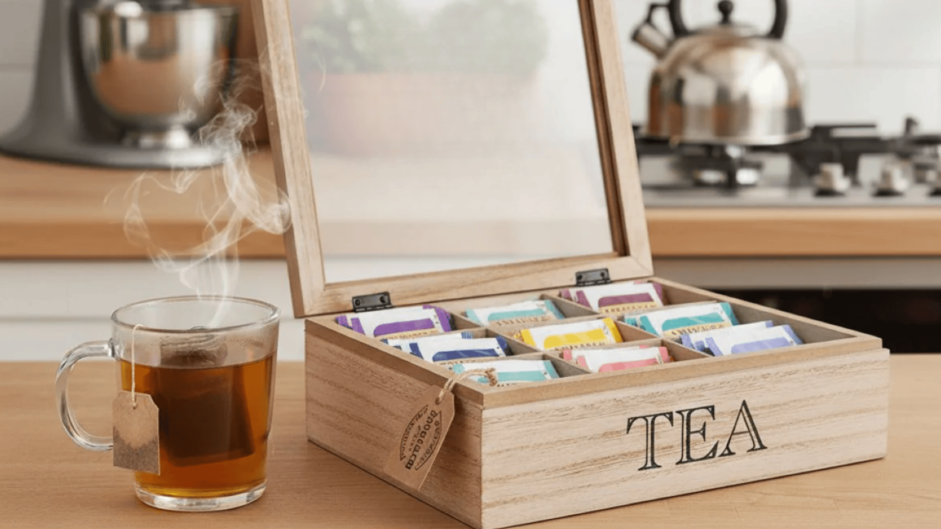 wooden tea storage box and tea bags on a kitchen counter a simple idea from easy wood projects for home organization