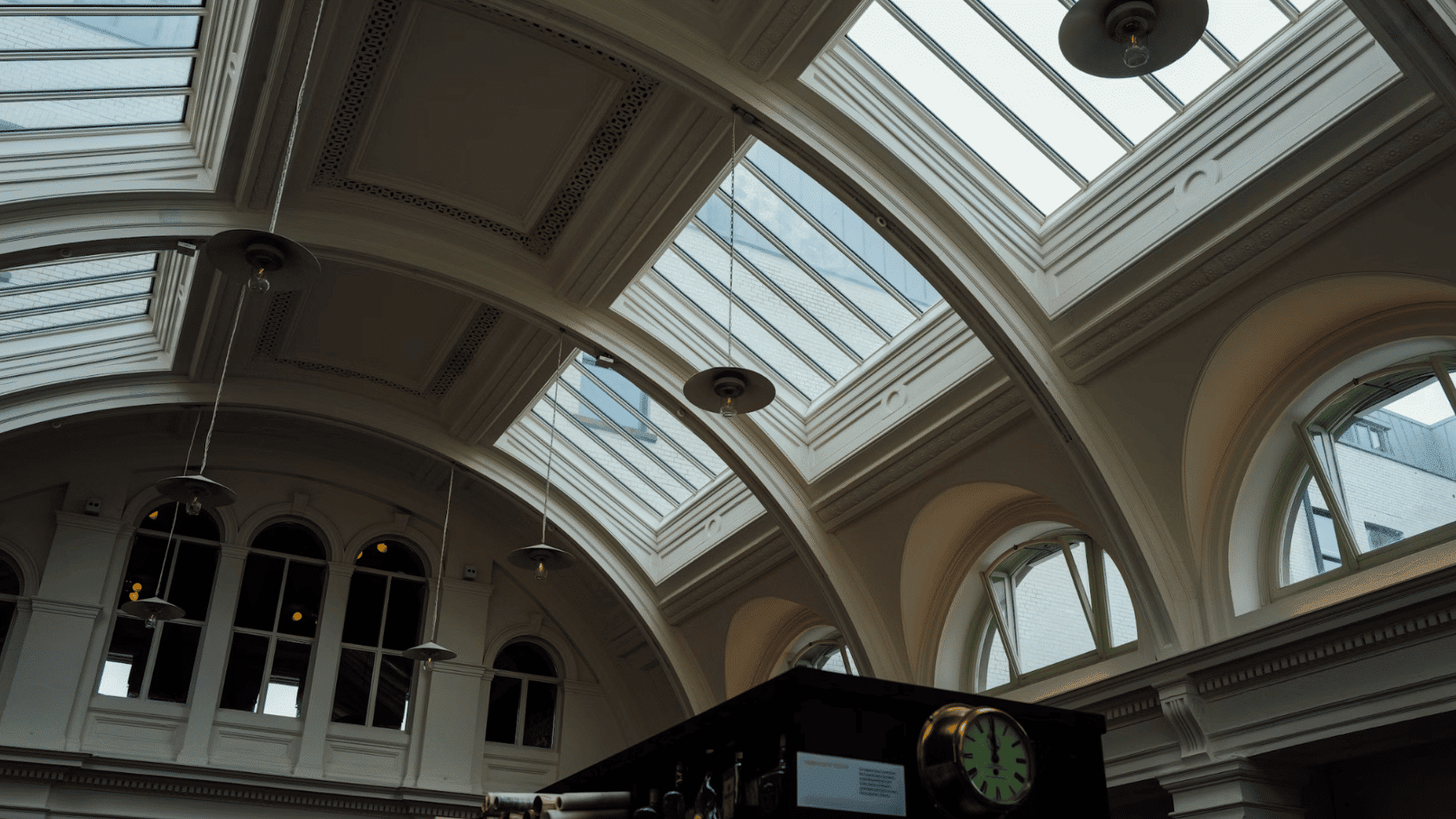 interior with arched skylights decorative ceiling details pendant lights and large clerestory windows