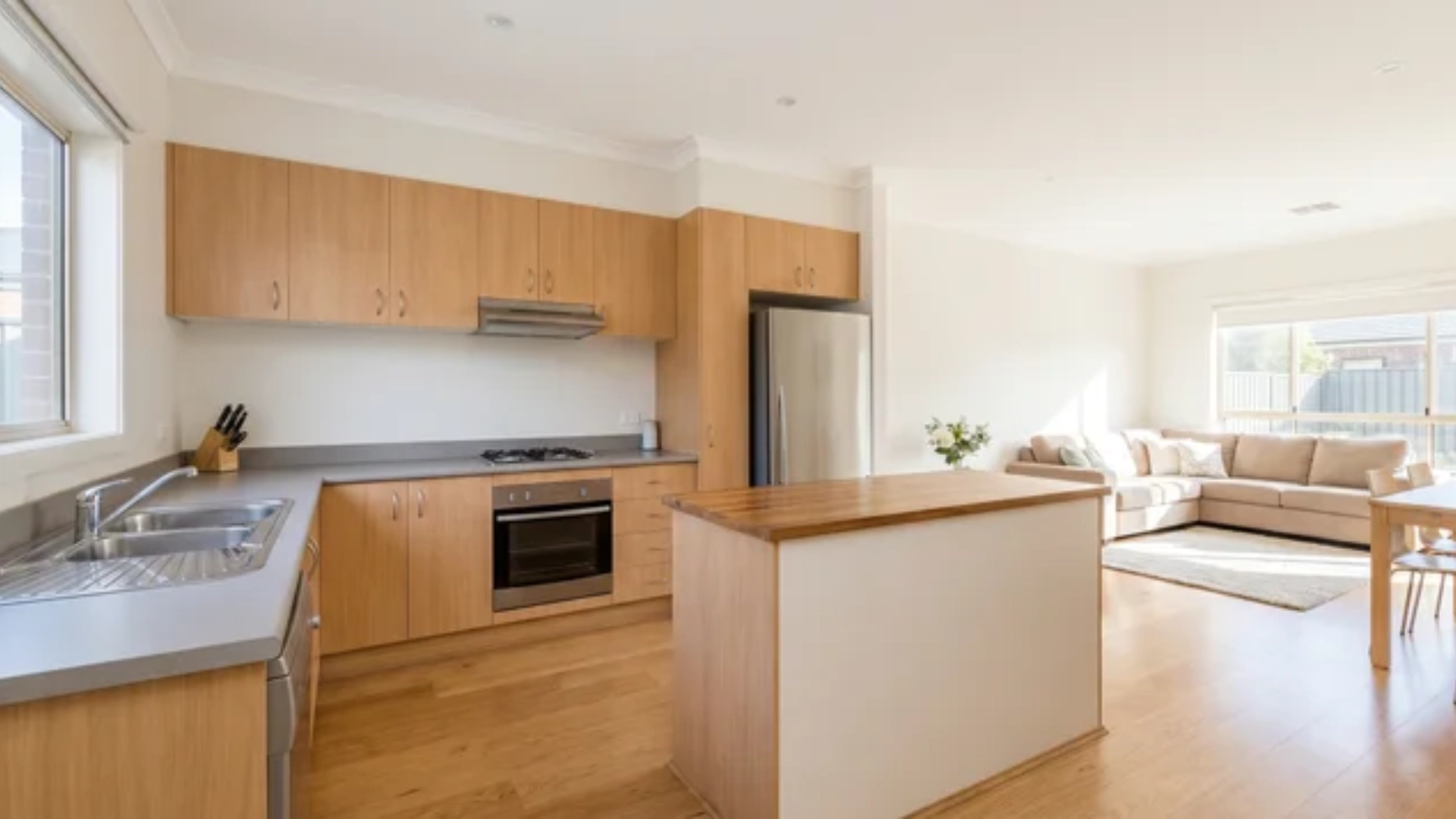 L-shaped kitchen with cabinets and appliances along two connecting walls forming a corner