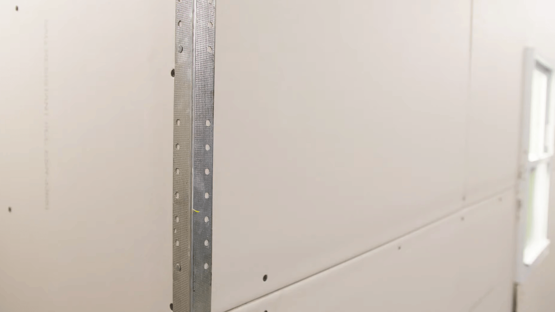 metal corner bead installed on an outside drywall corner to protect edges and create a clean straight finish for walls