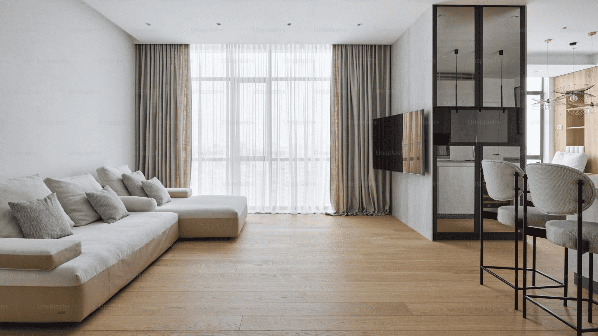 minimalist living room with light wood flooring large sofa sheer curtains and modern interior design