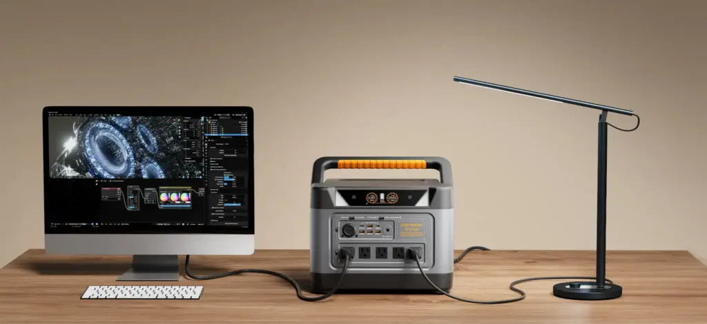Portable power station connecting desktop computer and desk lamp on wooden table in minimalist setting