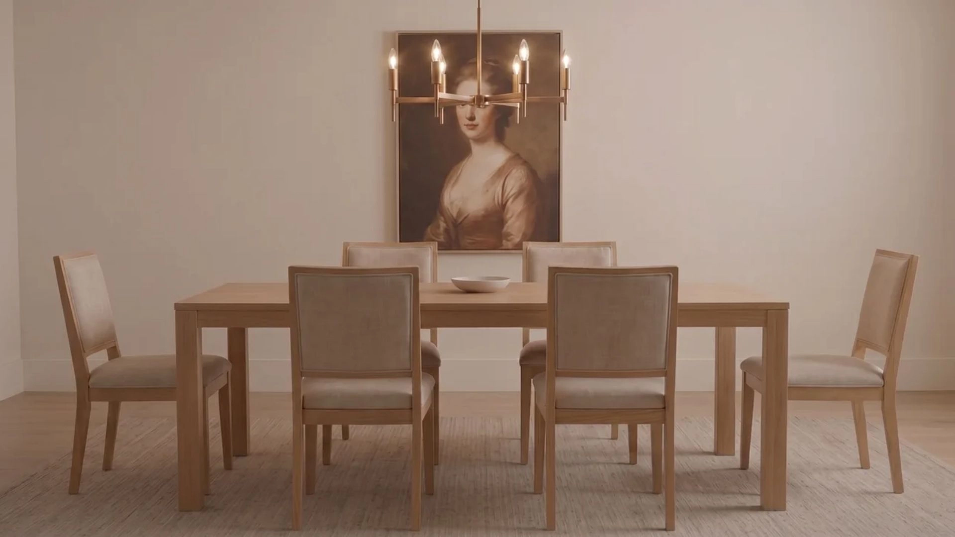 Chandelier sized about half the dining table width, centered to show correct lighting proportion.