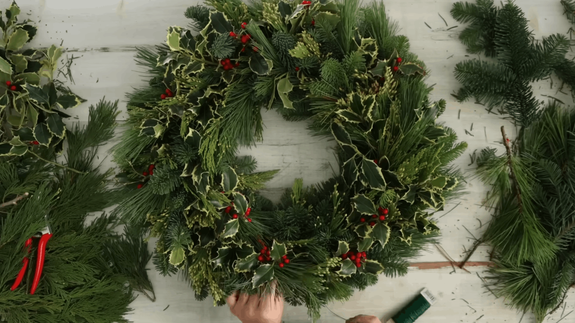 securing the wire on the back and spraying the wreath to help keep greenery fresh longer (1)
