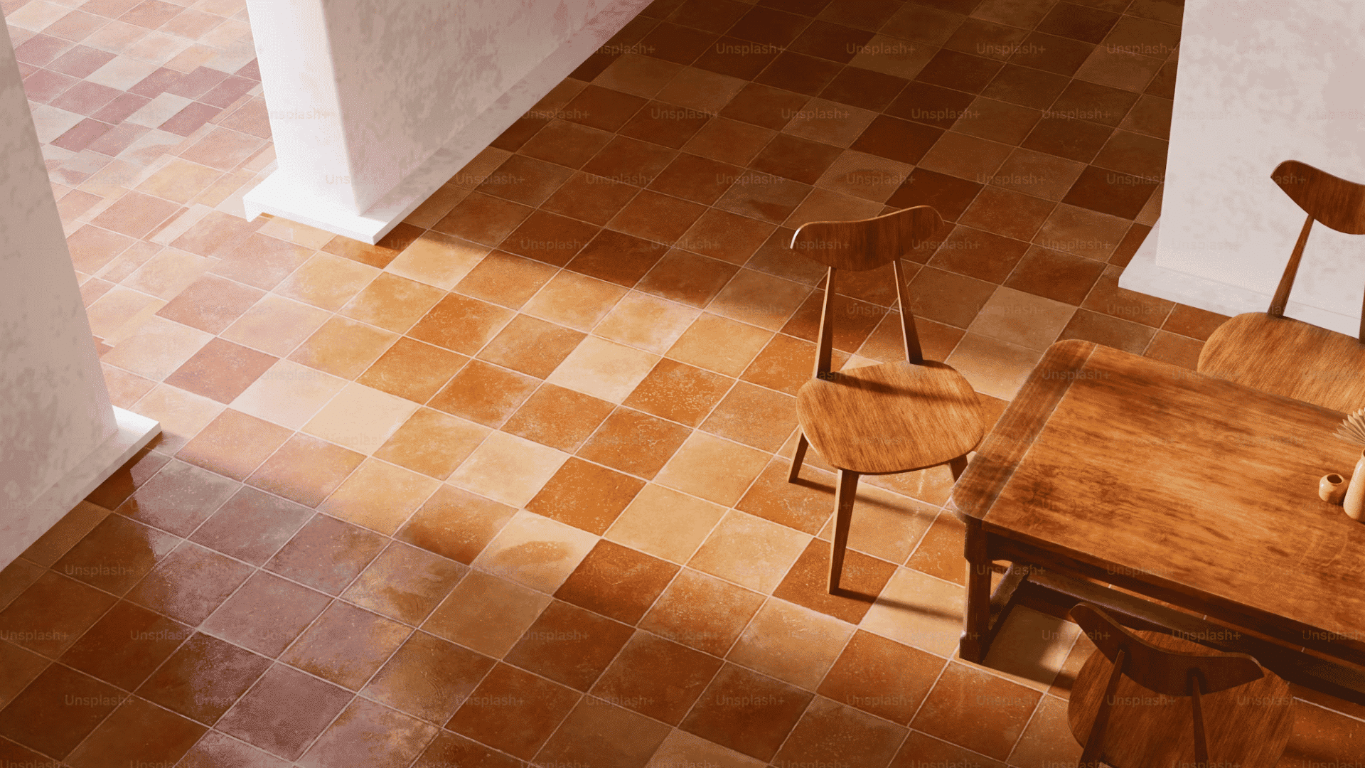 sunlit dining area with terracotta floor tiles wooden table and chairs viewed from above indoors