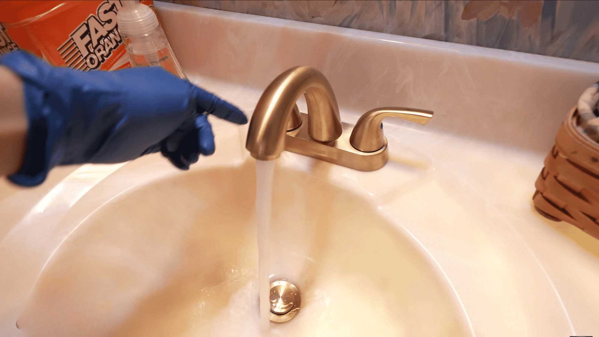 testing water flow from newly installed bathroom faucet after completing installation and connections