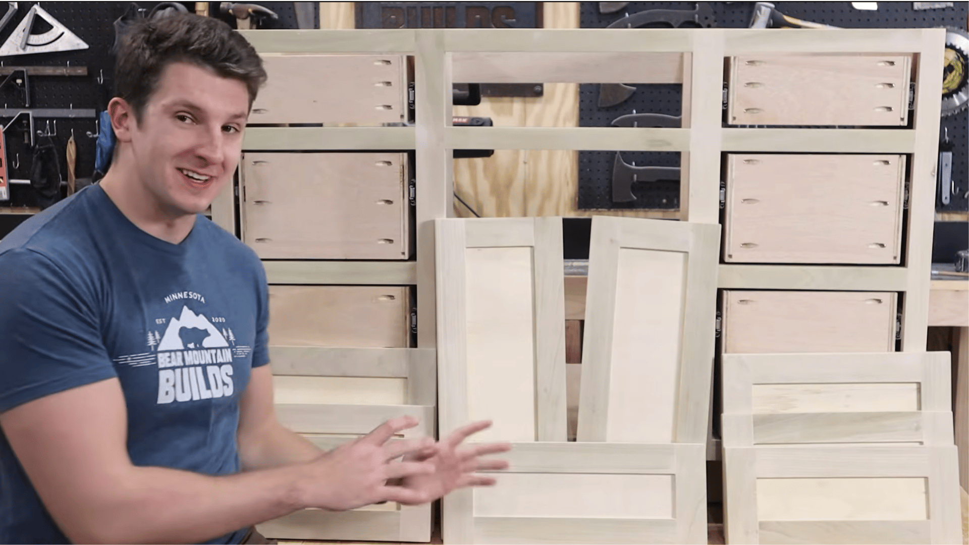 Wood cabinet doors and drawer fronts prepared during a DIY vanity construction project.