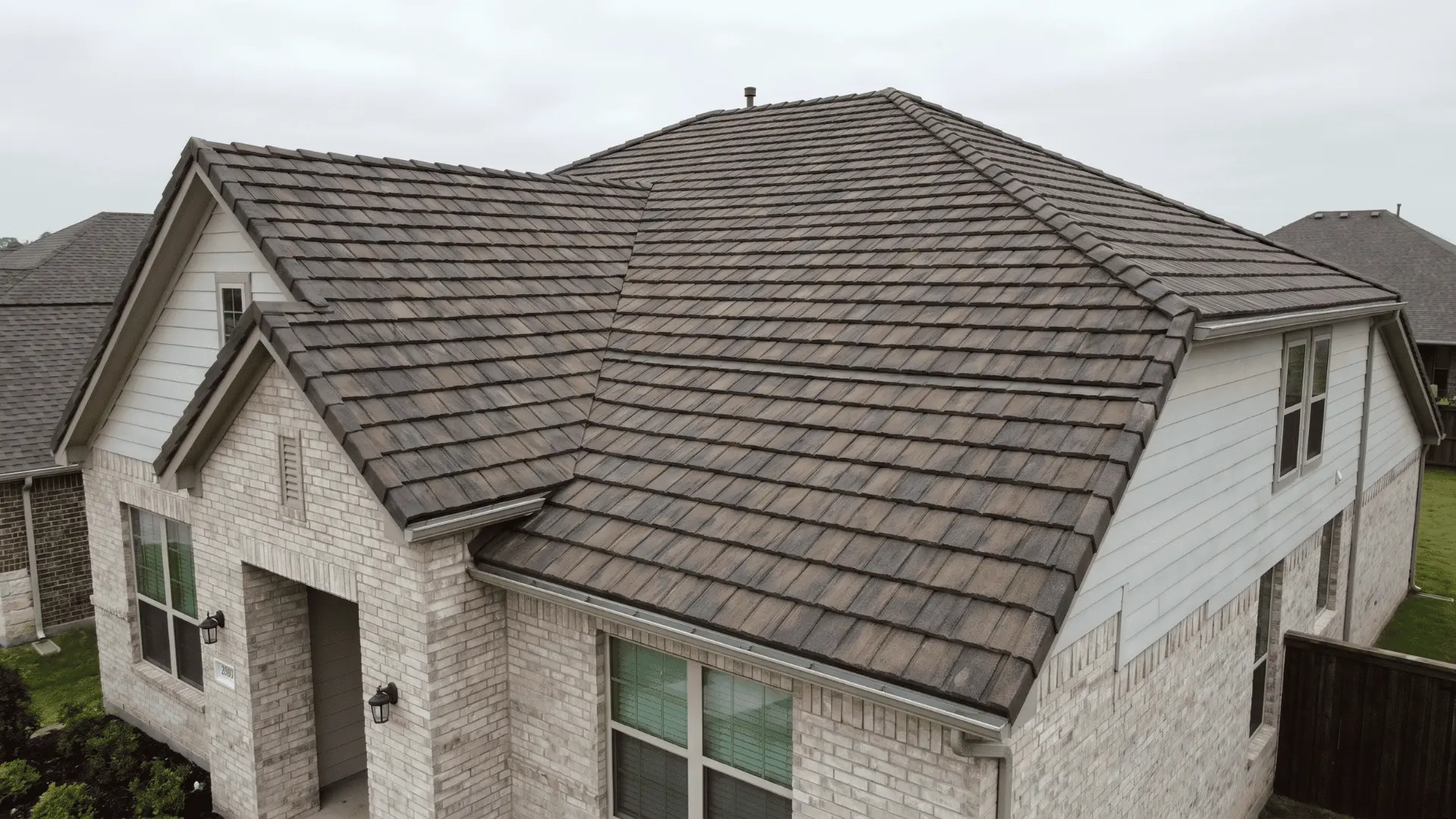 House with concrete roof tiles showing a durable roofing option.