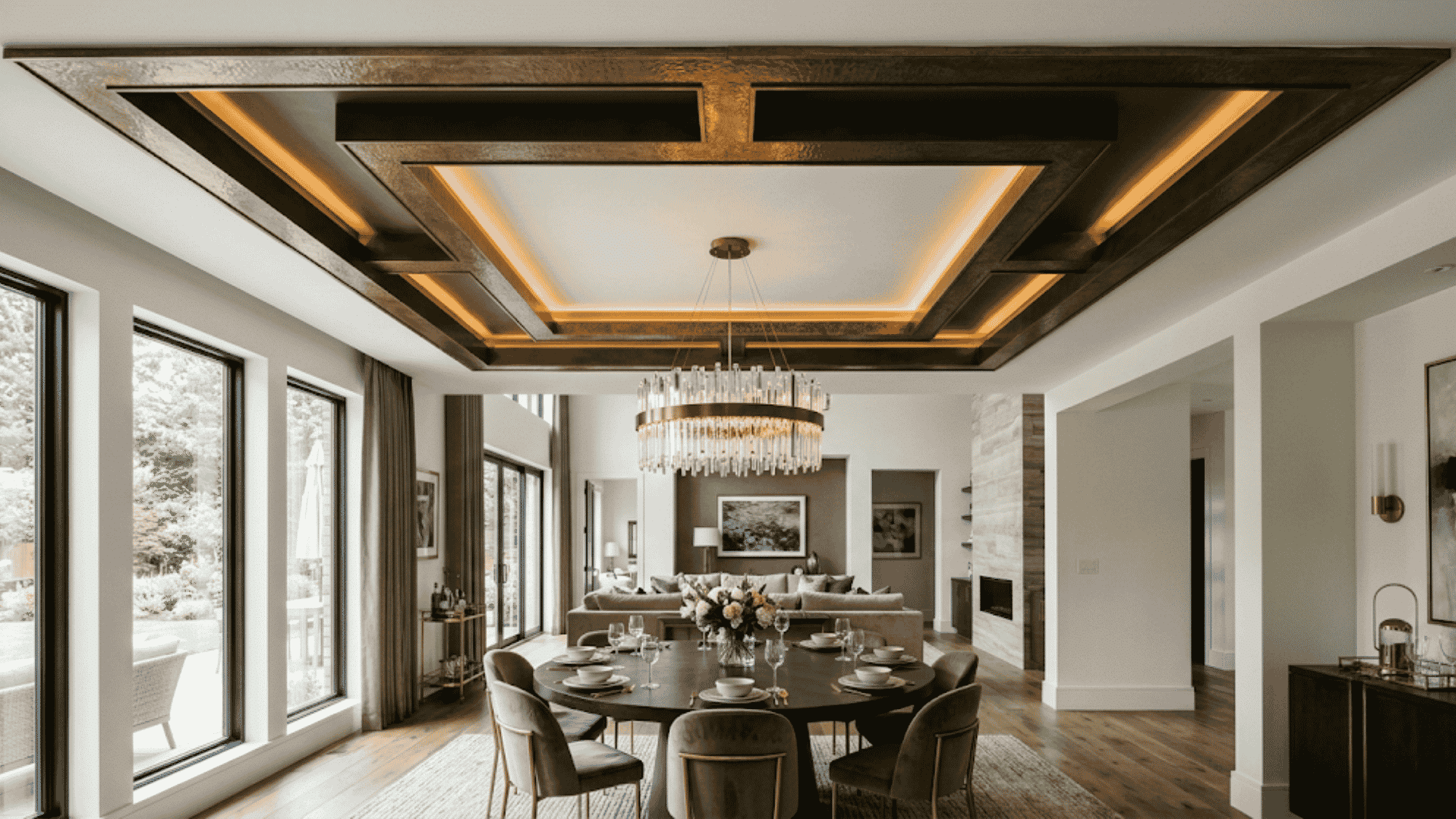 metallic accent tray ceiling with warm recessed lighting creating a luxurious modern dining room with elegant depth