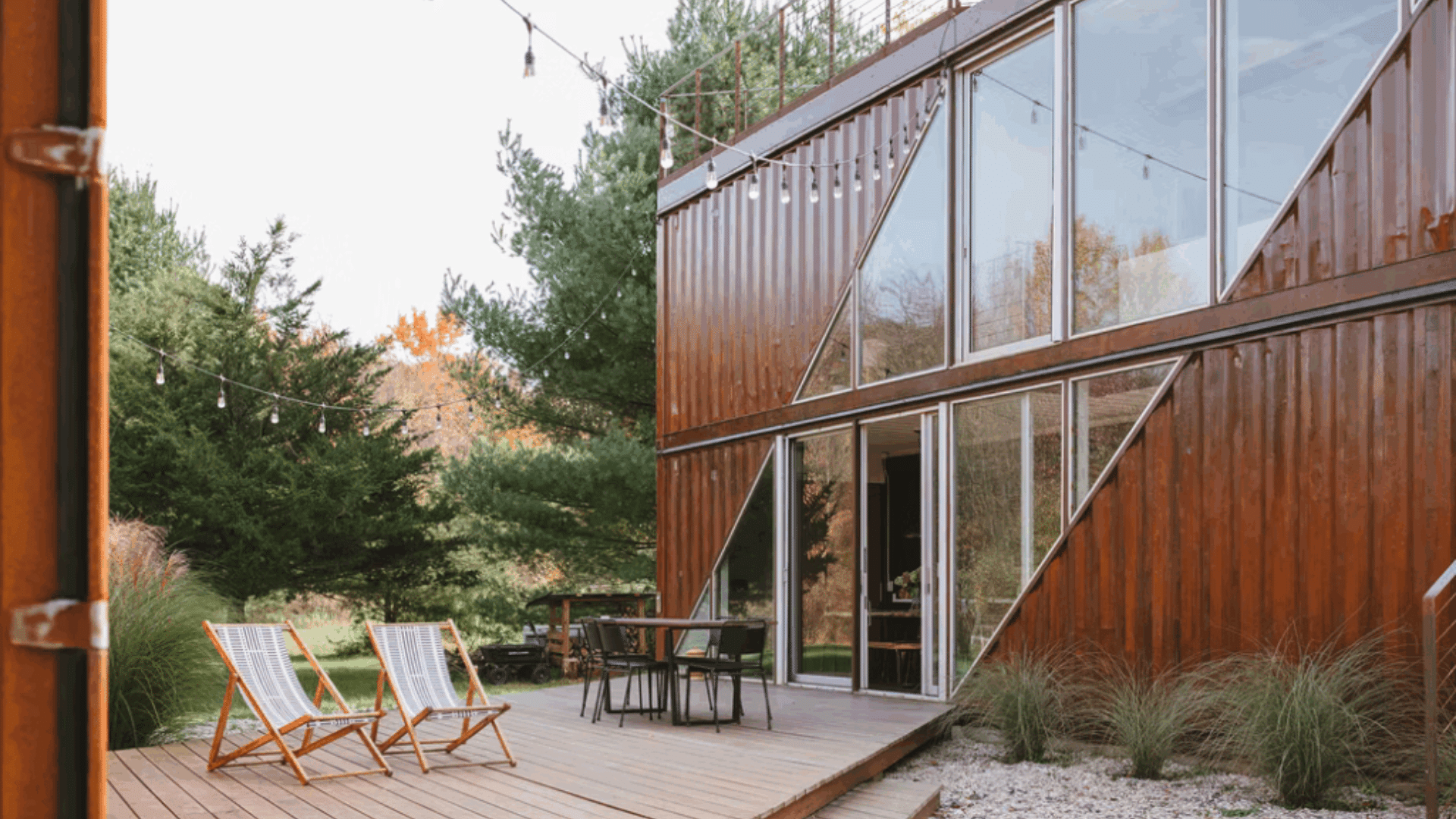 modern shipping container home with stacked steel containers large windows and compact energy efficient living space