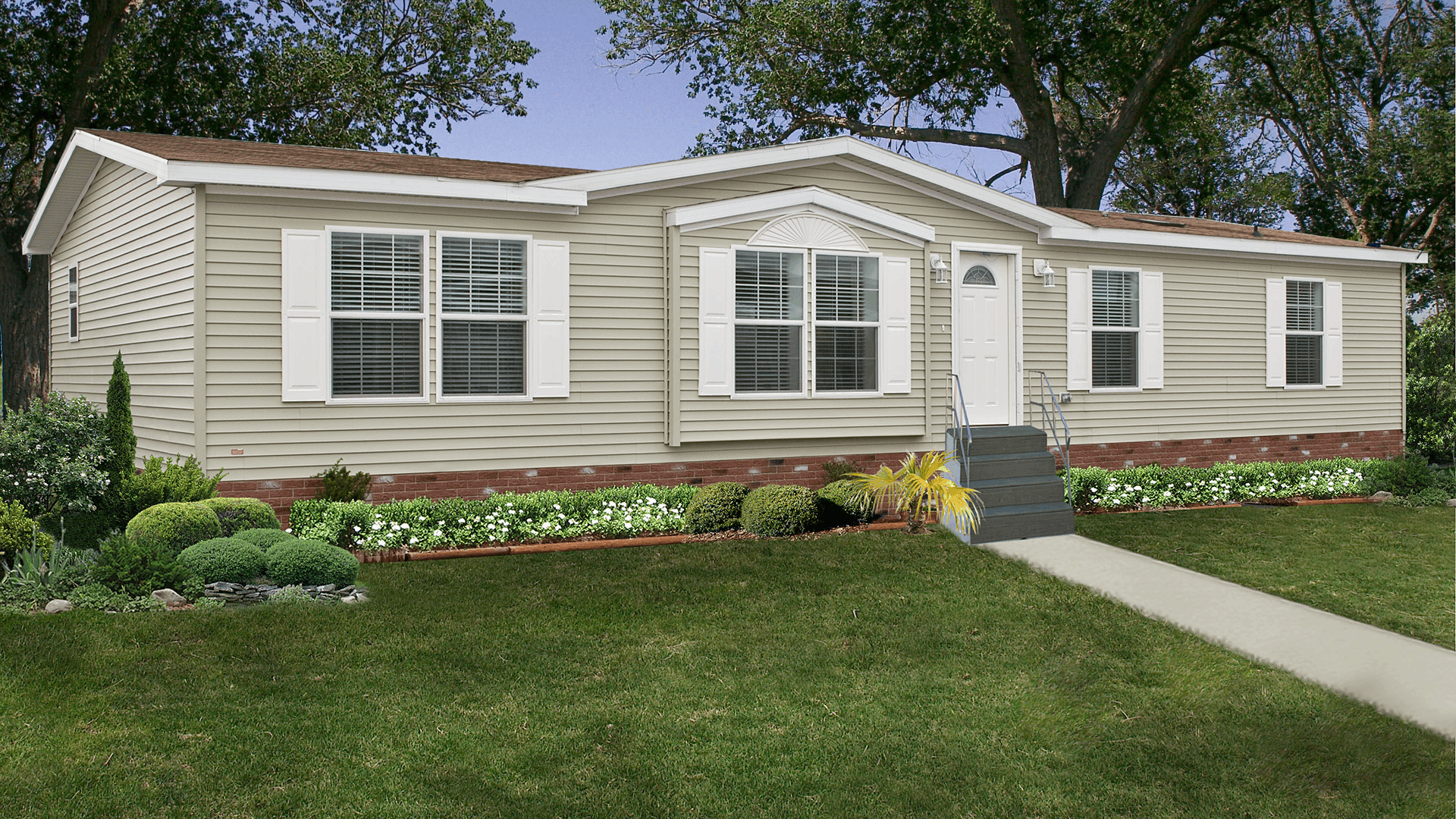 single section manufactured home with durable siding front steps and affordable residential layout in a community setting