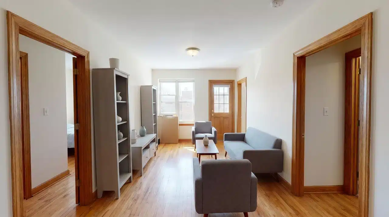 Small living room layout with multiple doorways and furniture arranged for easy movement.