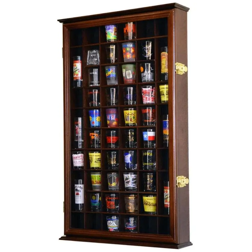 Wooden display case with multiple colorful souvenir shot glasses in each compartment