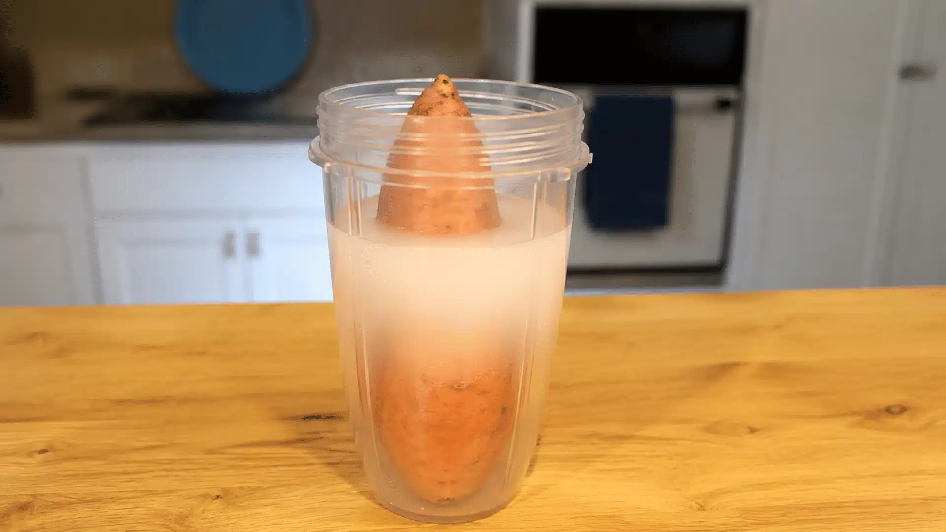 Sweet potato soaking in a solution before starting the slip-growing process