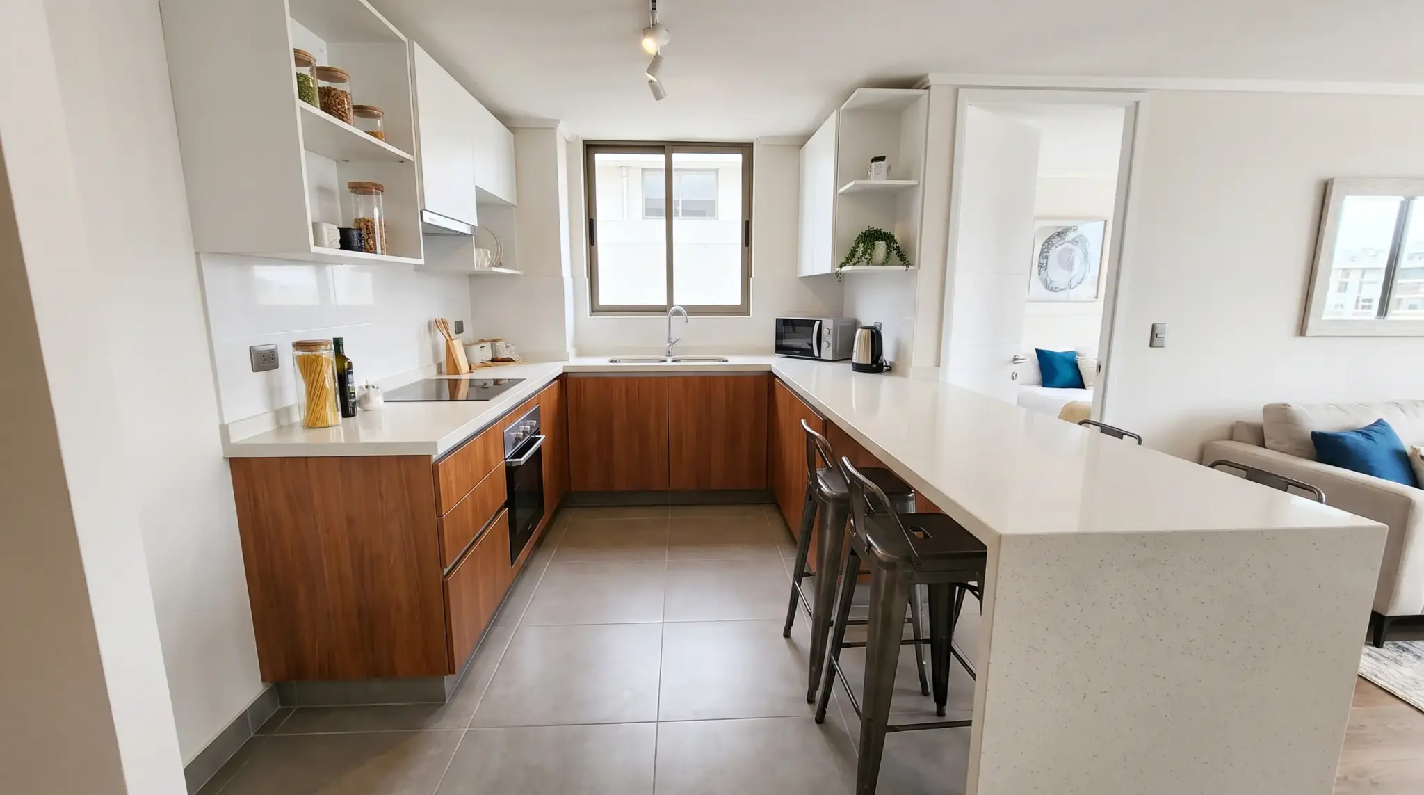 U-shaped kitchen with peninsula adding counter space and seating area