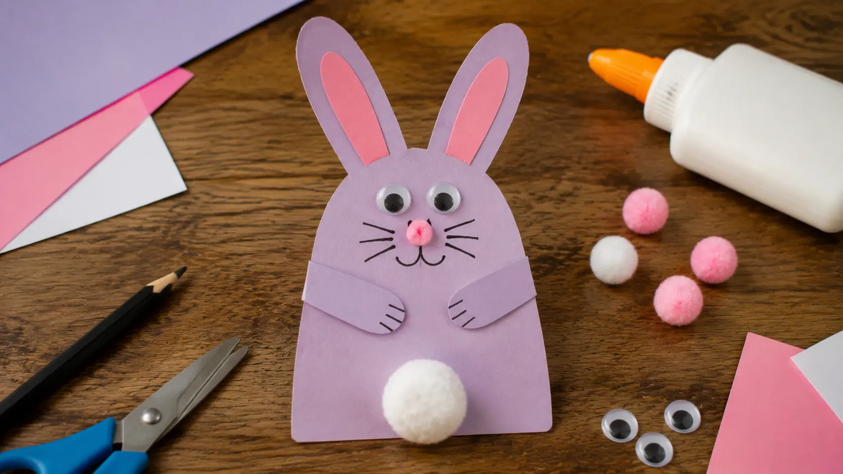 Handprint bunny keepsake craft with pom-pom tail