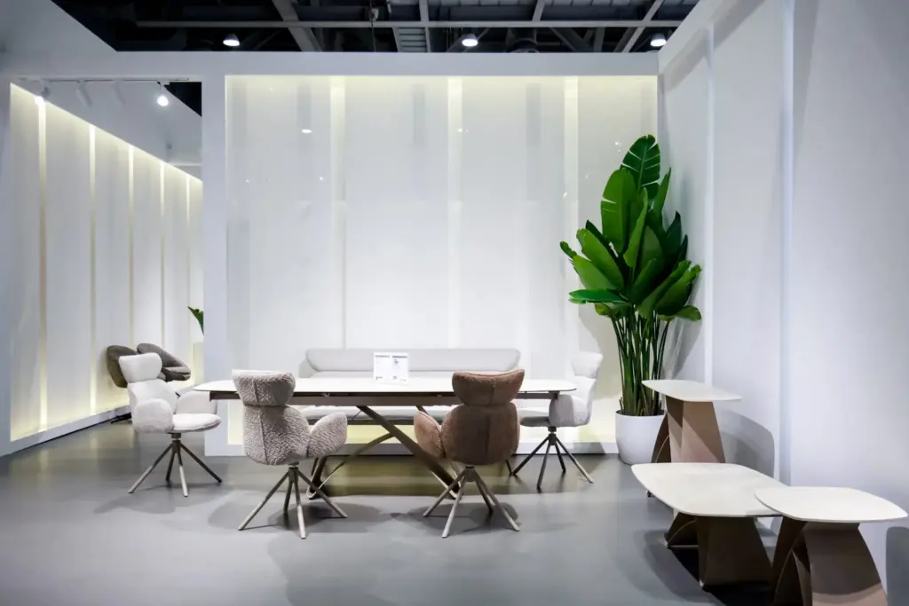 Modern Kitchen Design Ideas for a Stylish and Functional Home Modern office space with round table, upholstered chairs, and large potted plant in bright lighting