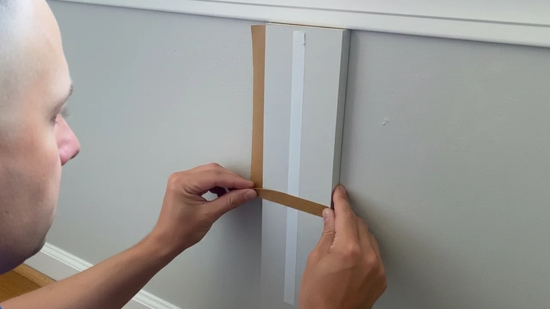 removable board and batten strip using adhesive backing
